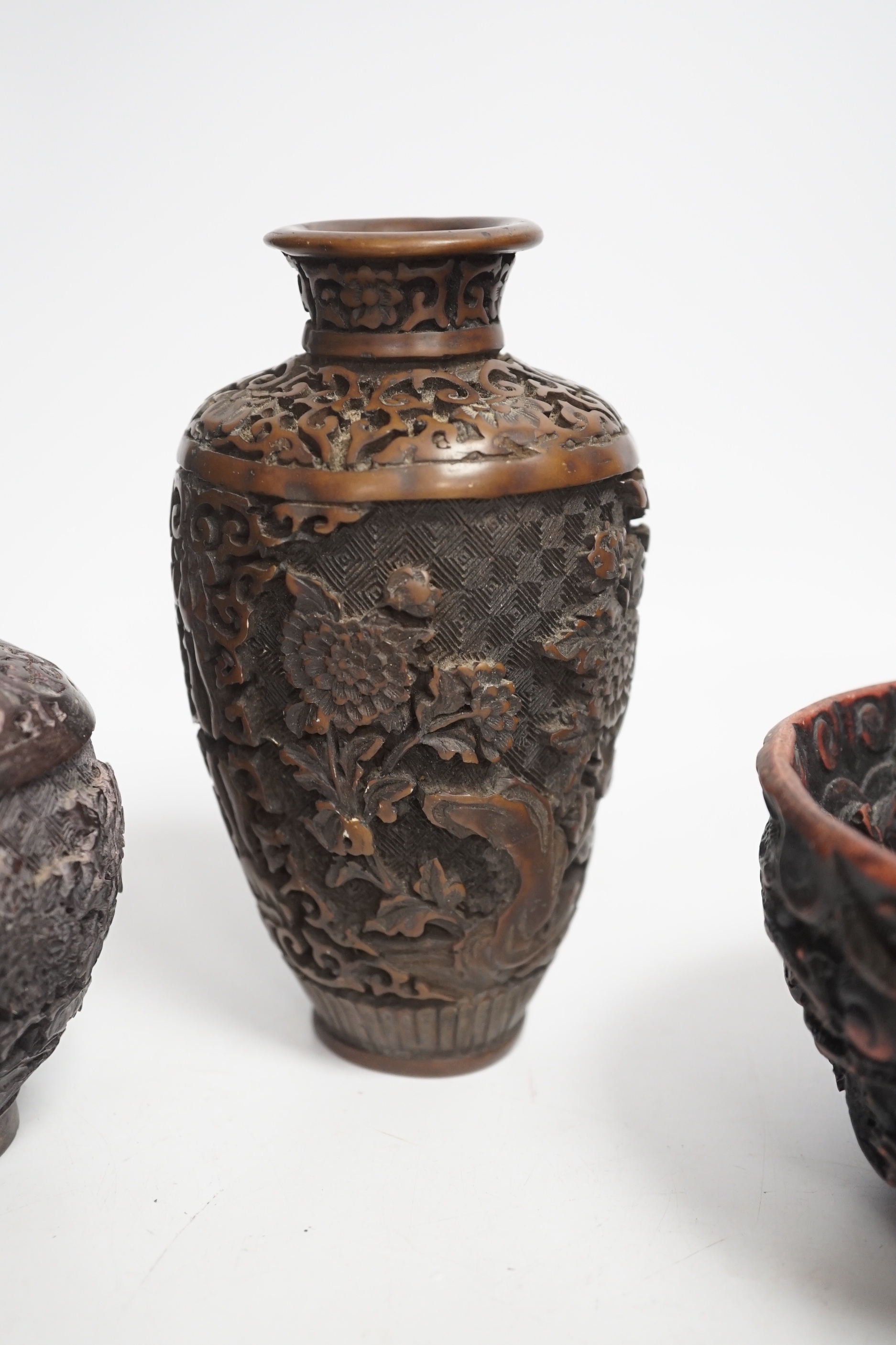 An Indian bronze bowl, two Chinese jars, 'dragon' bowl and a seated figure of Buddha, 15cm high